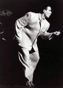 Black and white picture of David Byrne dancing in a boxy oversized suit from the Talking Heads concert film Stop Making Sense
